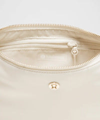 lululemon City Essentials Small Shoulder Bag 3L - LIGHT IVORY / GOLD